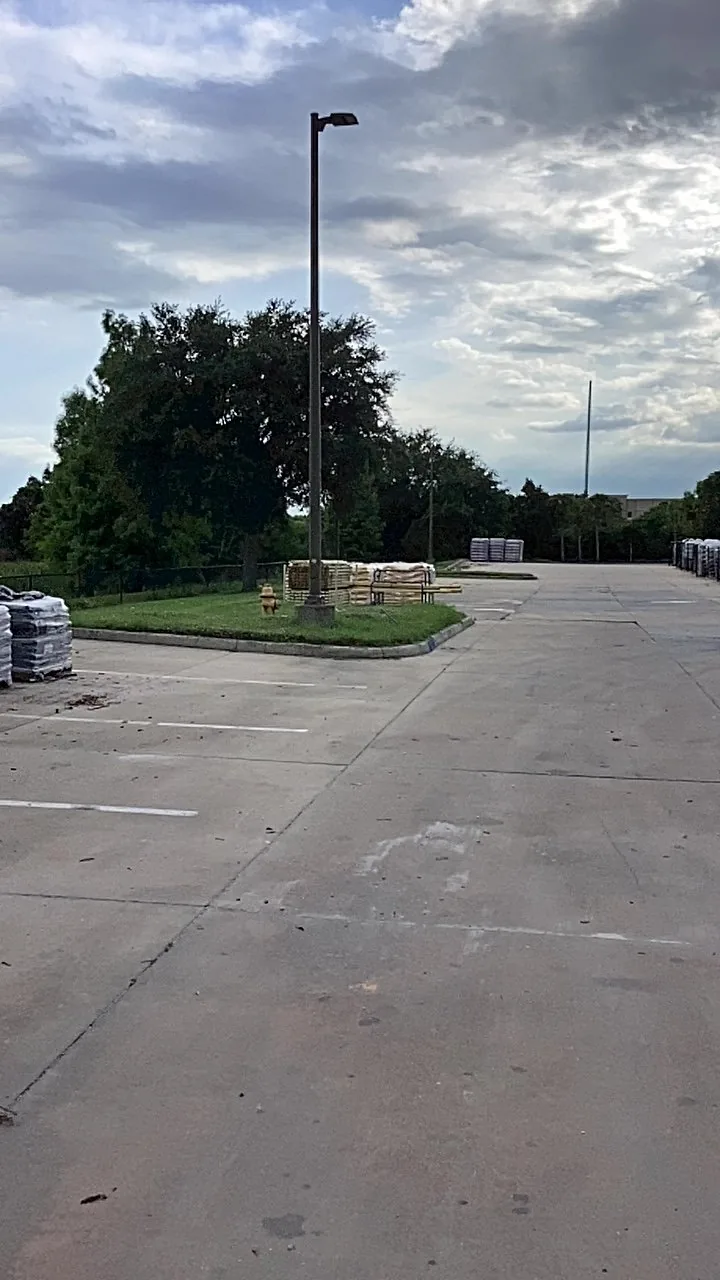Maintained turf island within a commercial parking area