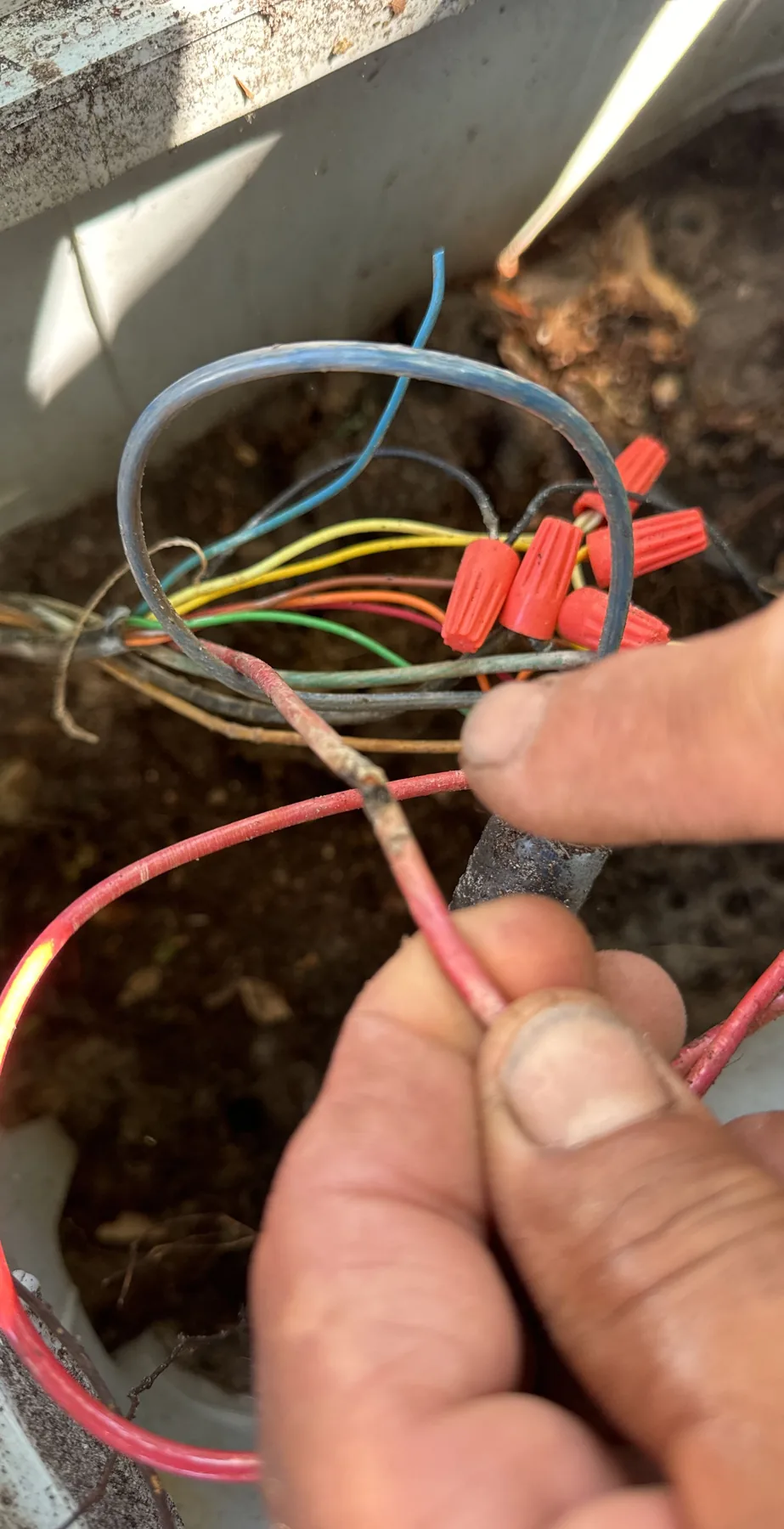Close view of irrigation control wiring during system work