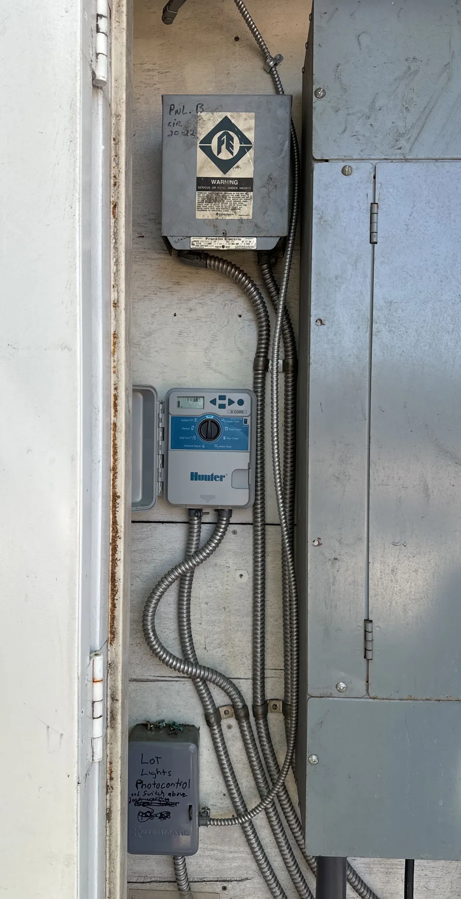 Wall-mounted irrigation controller and conduit