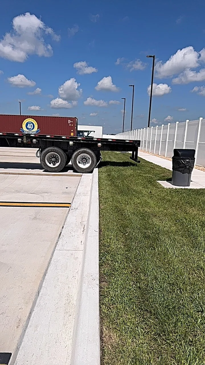 Neatly cut commercial turf beside a loading area
