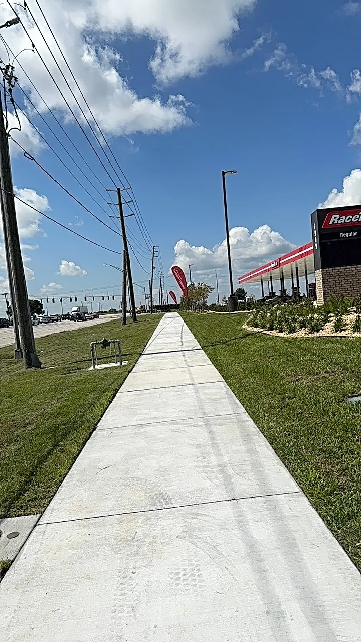 Roadside commercial lawn with maintained landscape beds