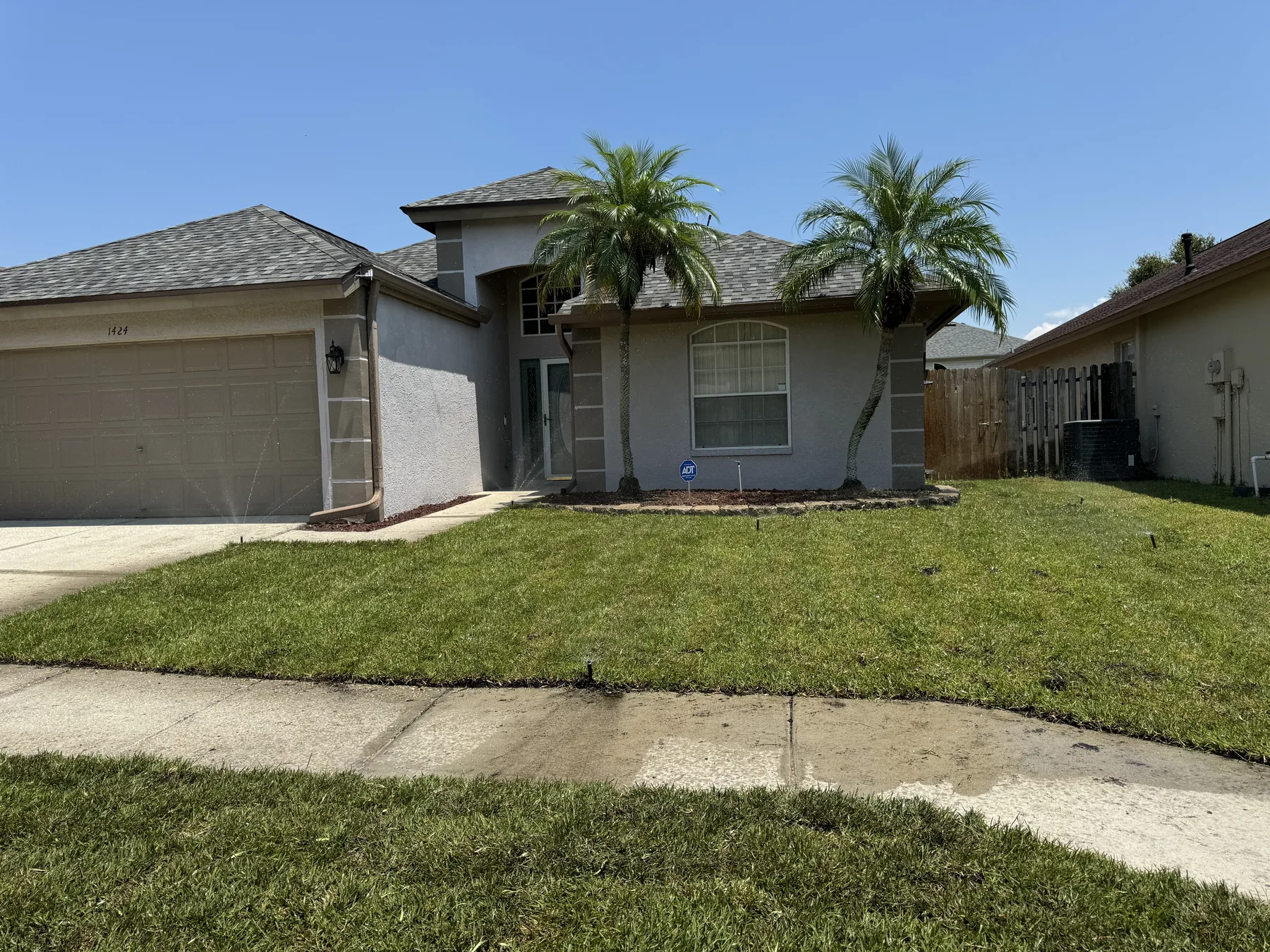 New sod and irrigation across a corner homesite