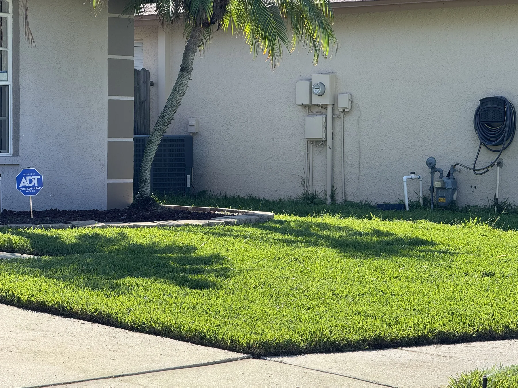 New sod fitted around residential utility connections