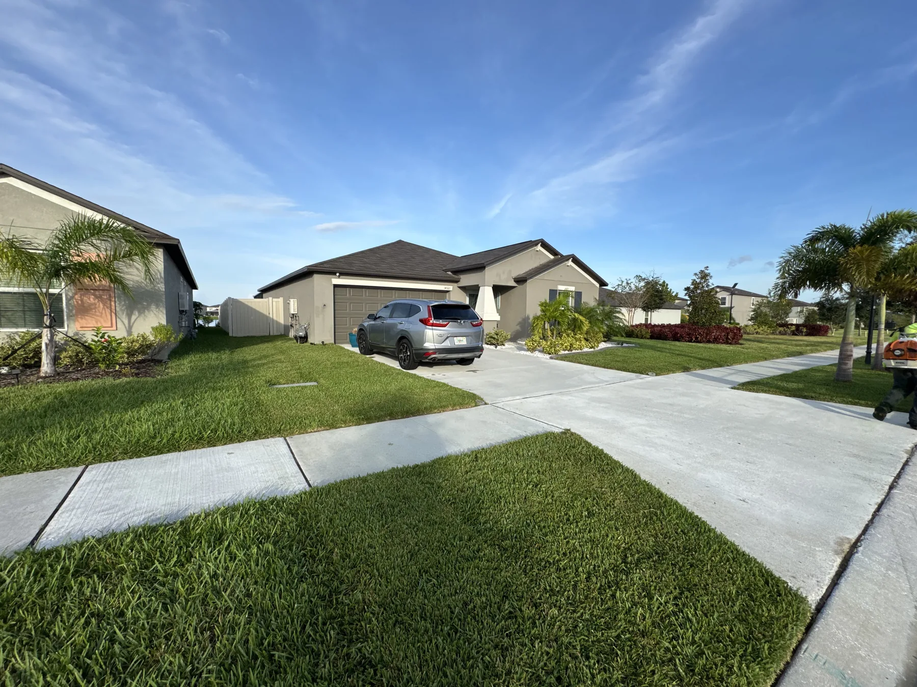 Maintained front lawns along a suburban streetscape