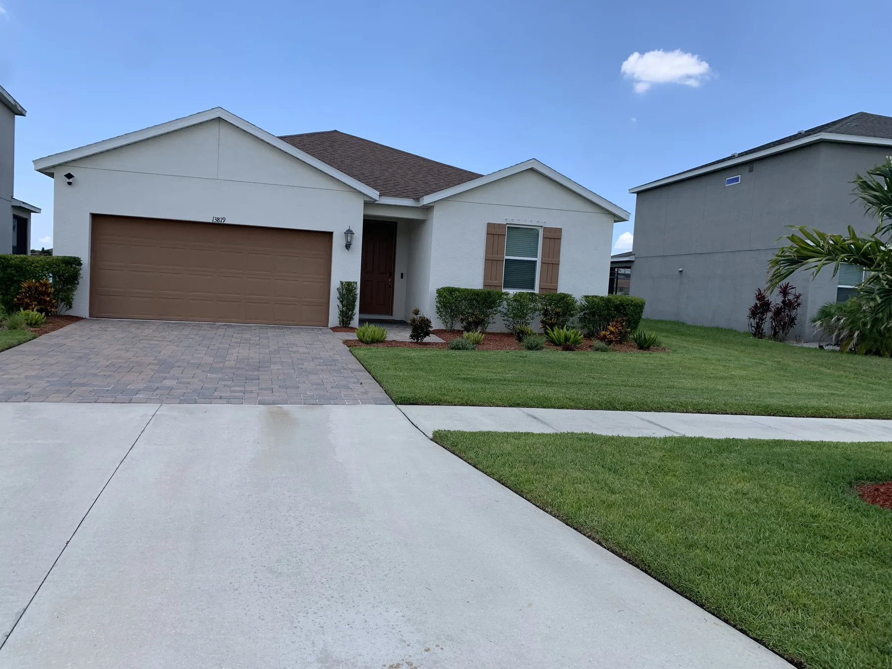 Maintained lawn and foundation landscaping at a residence